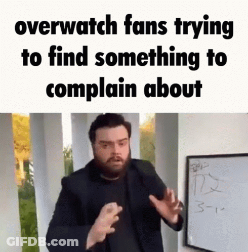 A Man With A Beard Is Standing In Front Of A White Board With The Words `` Overwatch Fans Trying To Find Something To Co GIF