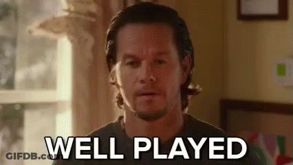 A Man With A Beard Is Standing In Front Of A Window And Says `` Well Played '' . GIF