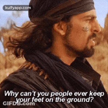 A Man With A Beard Is Standing In The Desert And Says Why Can 'T You People Ever Keep Your Feet On The Ground GIF