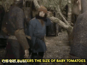 A Man With A Beard Is Standing In The Woods With The Words I 'Ve Got Blisters The Size Of Baby Tomatoes GIF