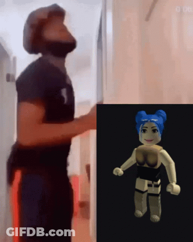 Man With Beard Next To Woman With Blue Hair GIF