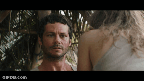 A Man With A Beard Is Standing Next To A Woman GIF
