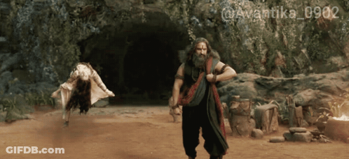 A Man With A Beard Is Standing Next To A Woman In A Cave With The Hashtag @Avantika_0902 GIF