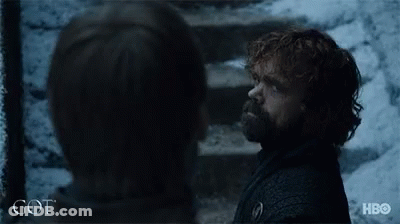 A Man With A Beard Is Standing Next To A Woman With The Word Got On The Bottom Of The Image GIF