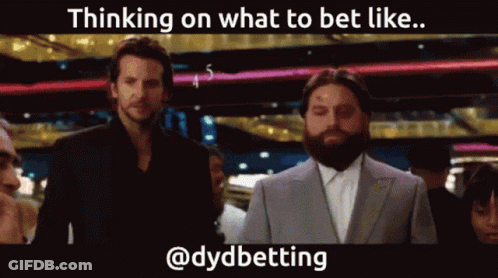 A Man With A Beard Is Standing Next To Another Man In A Suit With The Caption Thinking On What To Bet Like @Dydbetting GIF