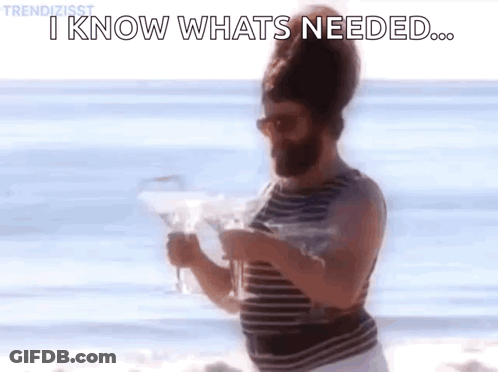 Man With Beard On Beach Holding Wine Saying I Know What's Needed GIF