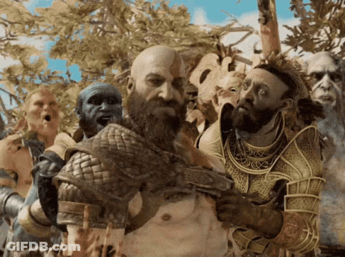 A Man With A Beard Is Surrounded By A Group Of People GIF