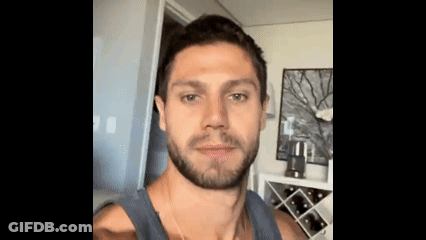 Man With Beard Taking Selfie In Living Room GIF