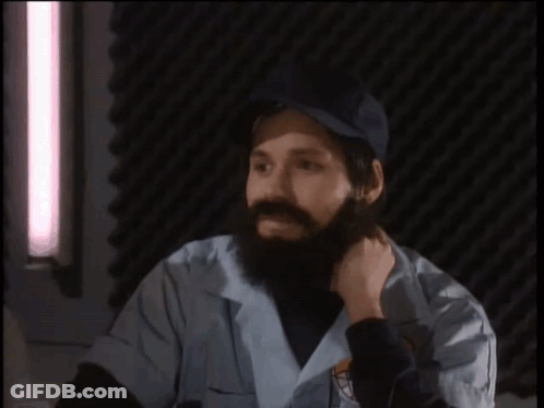 A Man With A Beard Is Talking About The Earth GIF