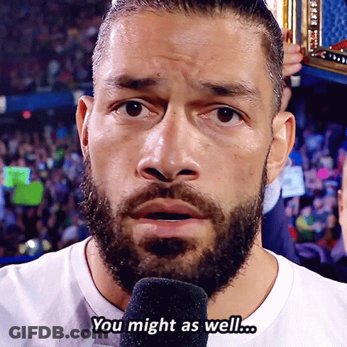 A Man With A Beard Is Talking Into A Microphone And The Words You Might As Well Are Above Him GIF