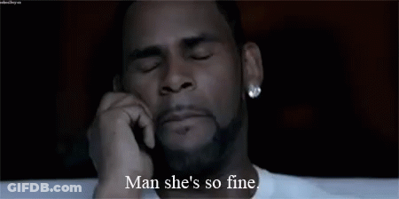 A Man With A Beard Is Talking On A Cell Phone And Saying Man She 'S So Fine . GIF