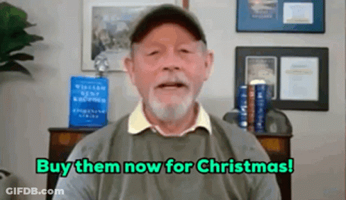 A Man With A Beard Is Talking On A Video Call And Saying Buy Them Now For Christmas . GIF