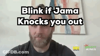 A Man With A Beard Is Talking On A Video Call With The Words `` Blink If Jama Knocks You Out '' Above Him . GIF
