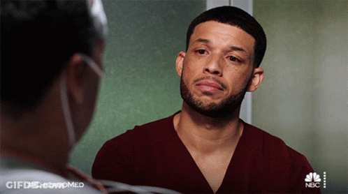 A Man With A Beard Is Talking To A Nurse With The Hashtag #Chicagomed On The Bottom GIF
