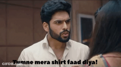 A Man With A Beard Is Talking To A Woman With The Words Tumne Mera Shirt Faad Diya On The Bottom GIF