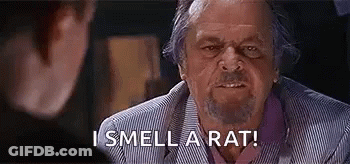 A Man With A Beard Is Talking To Another Man . GIF