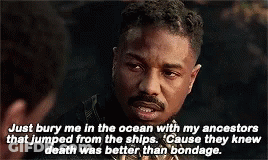 A Man With A Beard Is Talking To Another Man In A Movie Scene . GIF