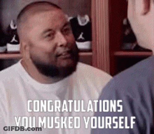 A Man With A Beard Is Talking To Another Man In Front Of A Closet . GIF