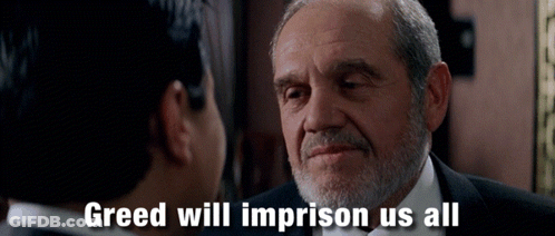 A Man With A Beard Is Talking To Another Man With Greed Will Imprison Us All Written Below Him GIF