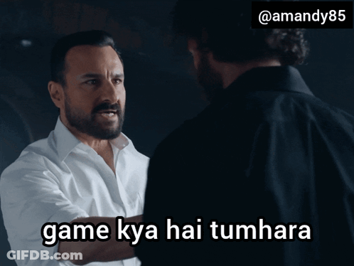 A Man With A Beard Is Talking To Another Man With The Words Game Kya Hai Tumhara Above Him GIF