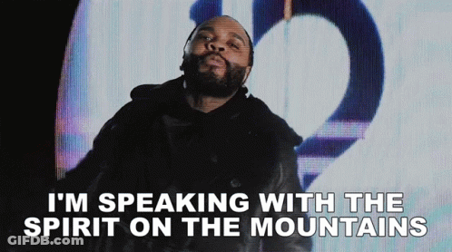 A Man With A Beard Is Talking With The Spirit On The Mountains GIF