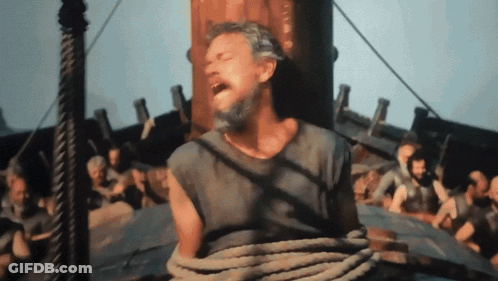 A Man With A Beard Is Tied To A Rope On A Ship GIF