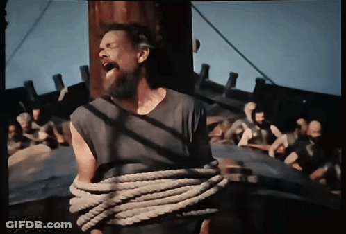 A Man With A Beard Is Tied Up With A Rope And Screaming GIF