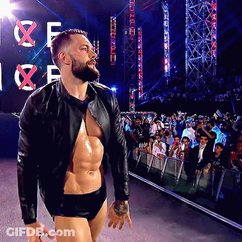 A Man With A Beard Is Walking In Front Of A Sign That Says X GIF