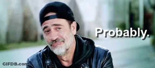 A Man With A Beard Is Wearing A Baseball Cap And A Leather Jacket And Is Smiling . GIF