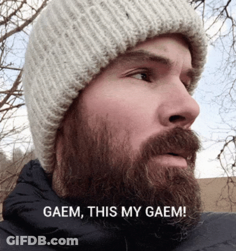 A Man With A Beard Is Wearing A Beanie And Says " Gaem This My Gaem " GIF