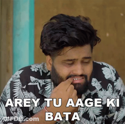 A Man With A Beard Is Wearing A Black And White Floral Shirt And Says " Arey Tu Aage Ki Bata " GIF