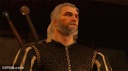 A Man With A Beard Is Wearing A Black And White Striped Jacket GIF