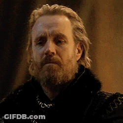 A Man With A Beard Is Wearing A Black Coat With A Fur Collar GIF