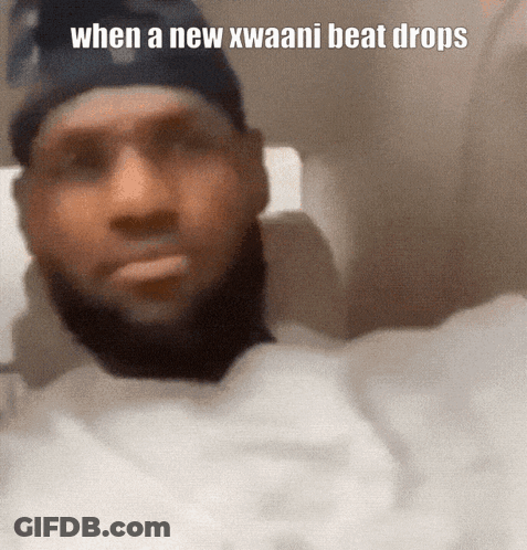 A Man With A Beard Is Wearing A Black Hat And A White Shirt With The Caption When A New Kwaani Beat Drops GIF