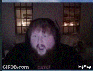 A Man With A Beard Is Wearing A Black Hoodie That Says Catch On The Front GIF