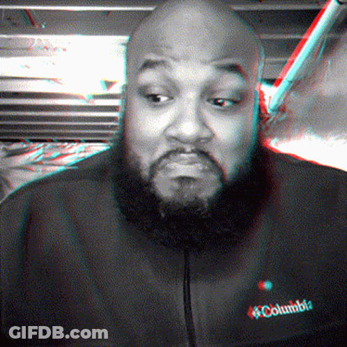 A Man With A Beard Is Wearing A Black Jacket That Says Columbia GIF