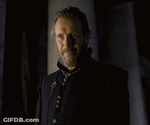 A Man With A Beard Is Wearing A Black Jacket GIF