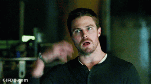 A Man With A Beard Is Wearing A Black Shirt GIF
