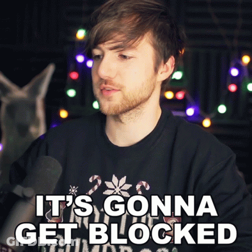 A Man With A Beard Is Wearing A Black Shirt That Says " It 'S Gonna Get Blocked " GIF