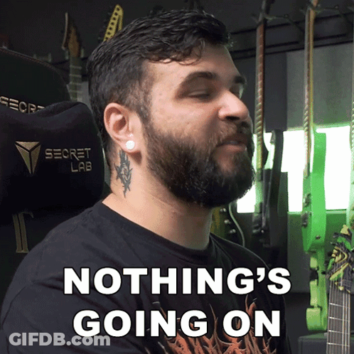 A Man With A Beard Is Wearing A Black Shirt That Says Nothing 'S Going On GIF