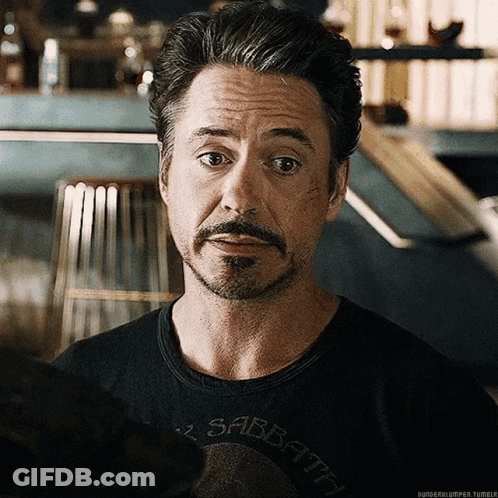 A Man With A Beard Is Wearing A Black Shirt That Says Sabbath GIF