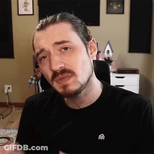 Man With Beard Wearing Black Shirt With Chinese Symbol GIF