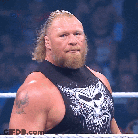 A Man With A Beard Is Wearing A Black Tank Top With A White Skull On It GIF
