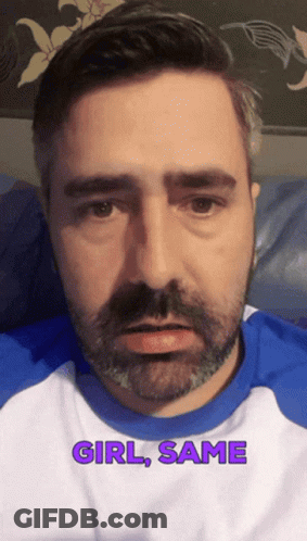 A Man With A Beard Is Wearing A Blue And White Shirt With The Words Girl Same On It GIF