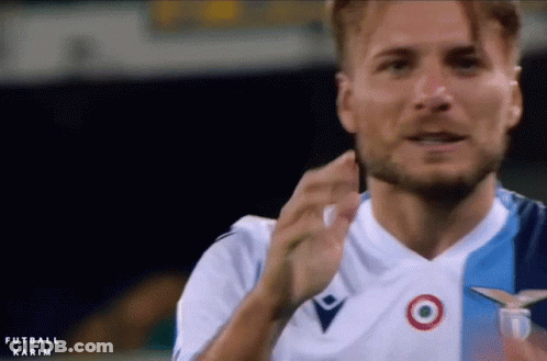 A Man With A Beard Is Wearing A Blue And White Soccer Jersey With A Target On It GIF
