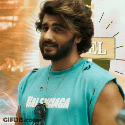 A Man With A Beard Is Wearing A Blue Balenciaga T-Shirt GIF