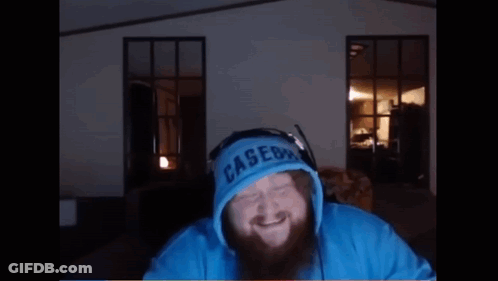 A Man With A Beard Is Wearing A Blue Hoodie That Says ' Lakers ' On The Front GIF