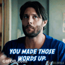 A Man With A Beard Is Wearing A Blue Jersey That Says " You Made Those Words Up " GIF