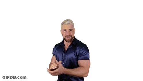 A Man With A Beard Is Wearing A Blue Shirt And Dancing GIF
