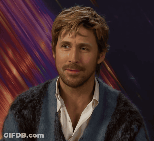 A Man With A Beard Is Wearing A Blue Sweater And A White Shirt GIF